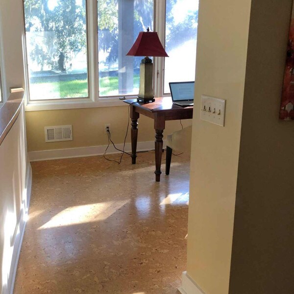 Sierra cork flooring in a home office overlooking a grassy space